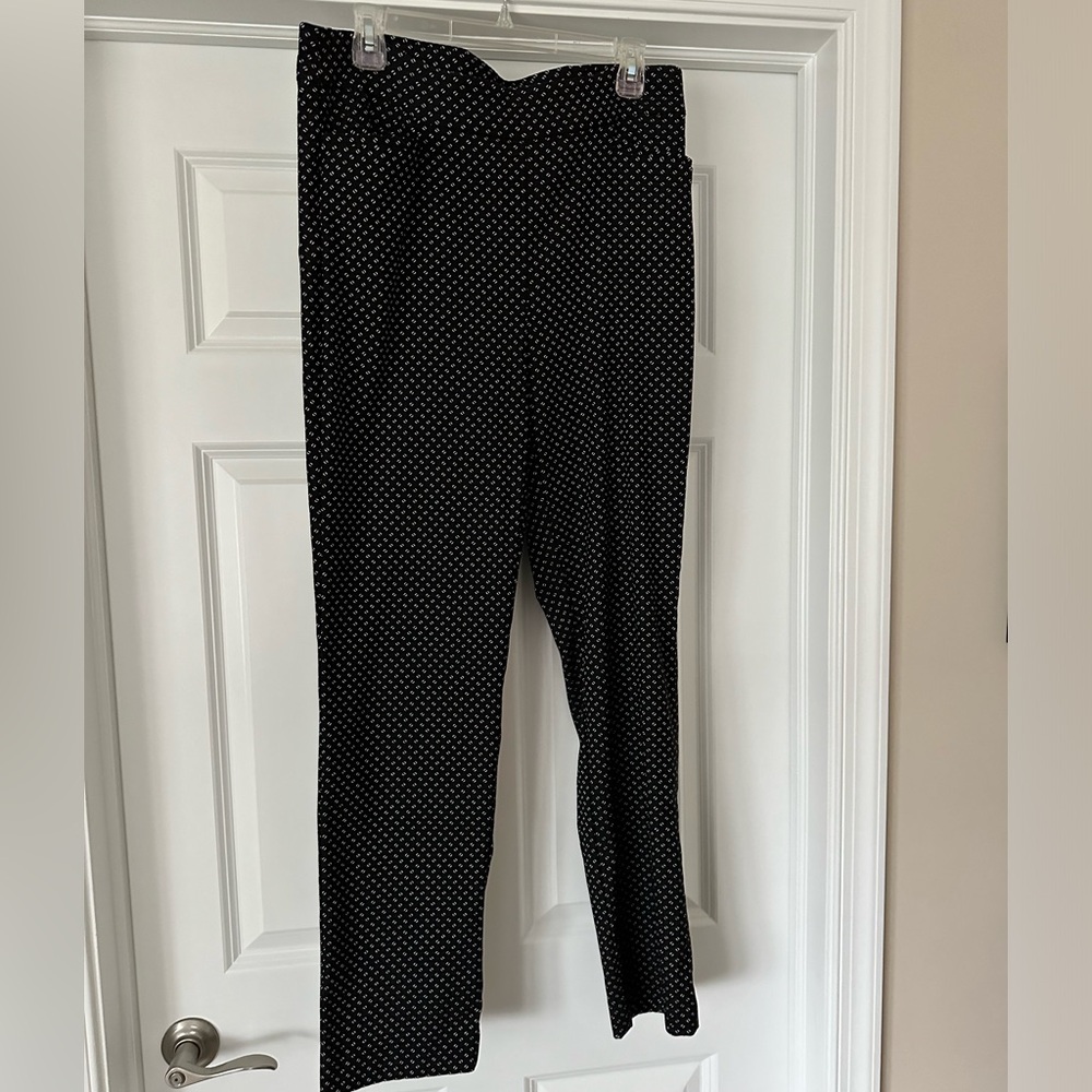 Chicos black weekender pant with small white dot pattern.  Size 2R